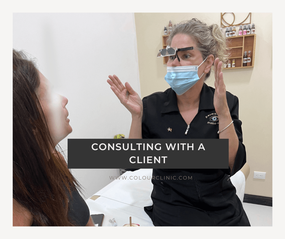Engaging with a client before treatment to discuss her desired visual outcome.